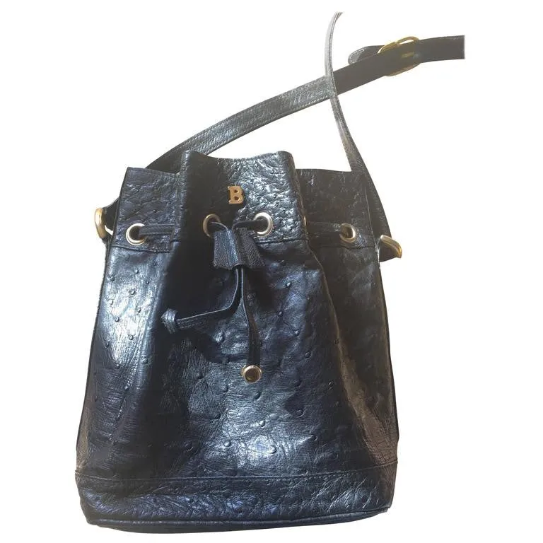 80's vintage BALLY genuine black ostrich leather hobo bucket shoulder bag with golden B logo and drawstrings.