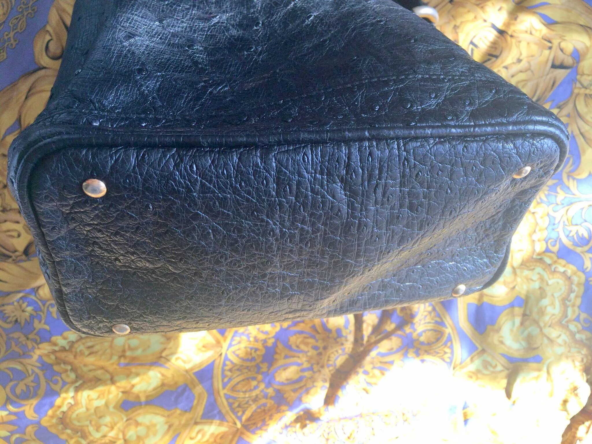 80's vintage BALLY genuine black ostrich leather hobo bucket shoulder bag with golden B logo and drawstrings.