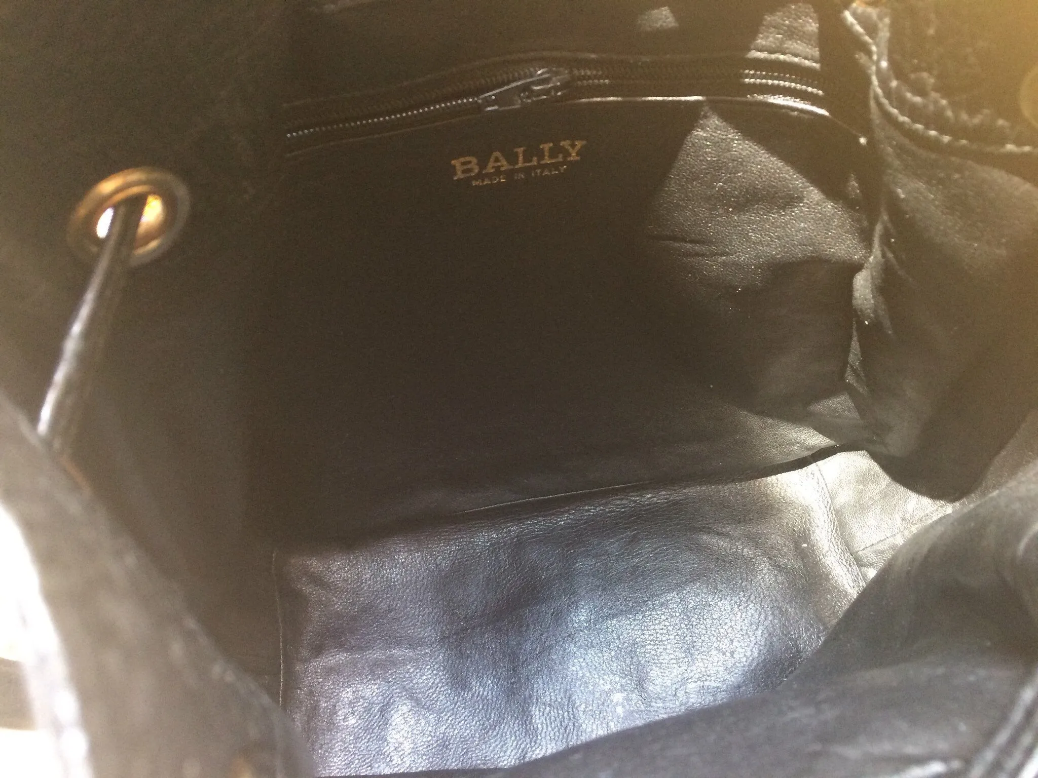 80's vintage BALLY genuine black ostrich leather hobo bucket shoulder bag with golden B logo and drawstrings.