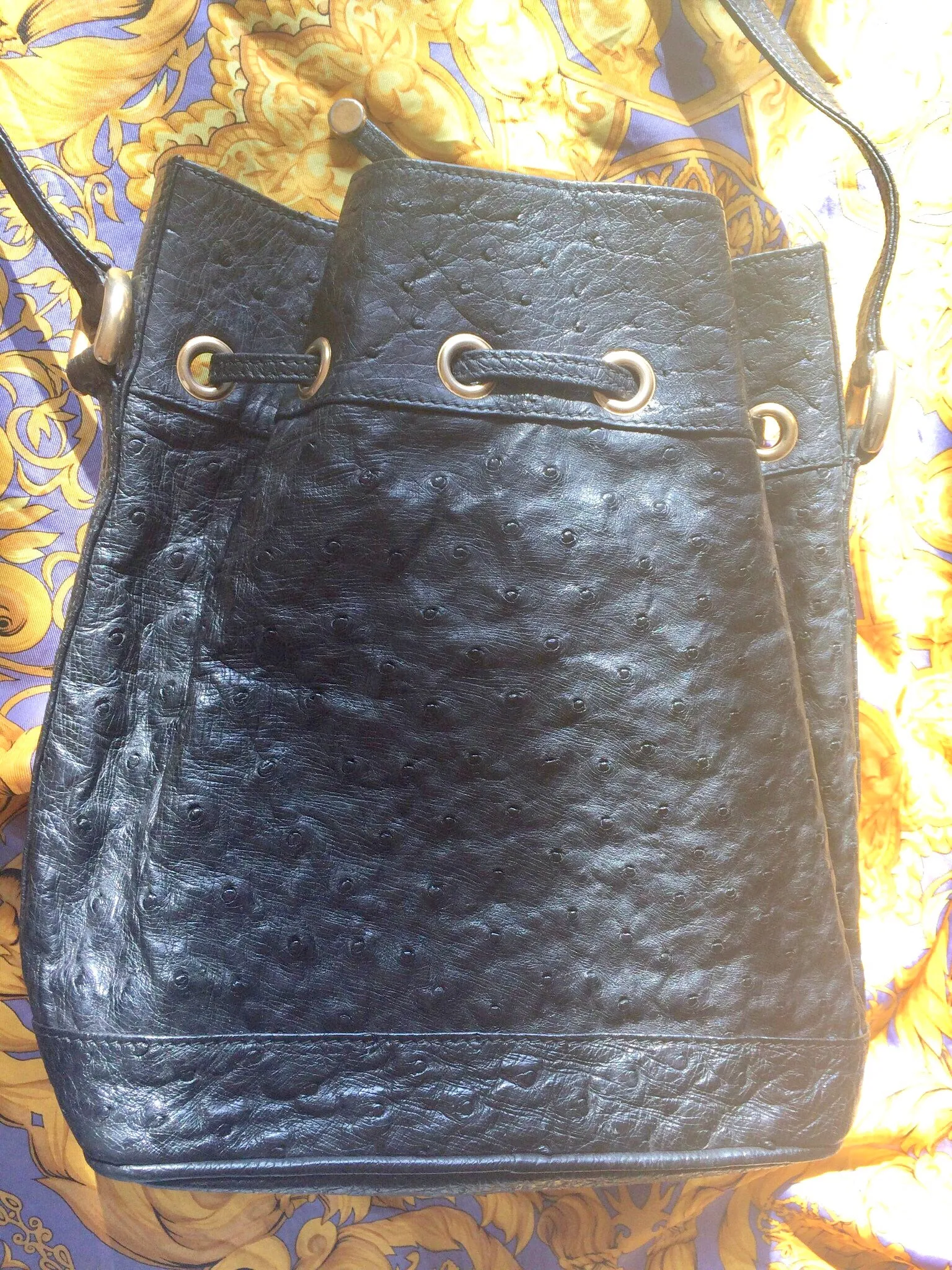 80's vintage BALLY genuine black ostrich leather hobo bucket shoulder bag with golden B logo and drawstrings.