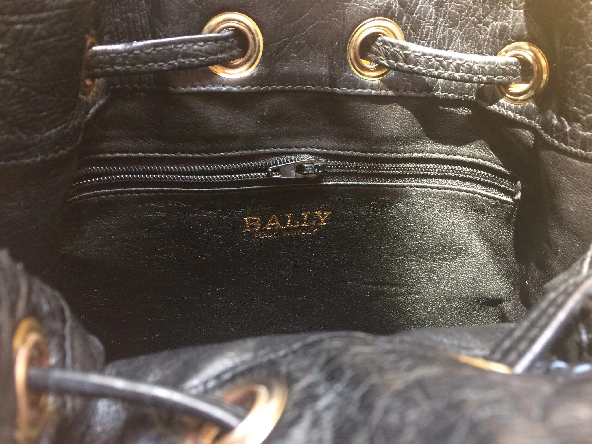 80's vintage BALLY genuine black ostrich leather hobo bucket shoulder bag with golden B logo and drawstrings.