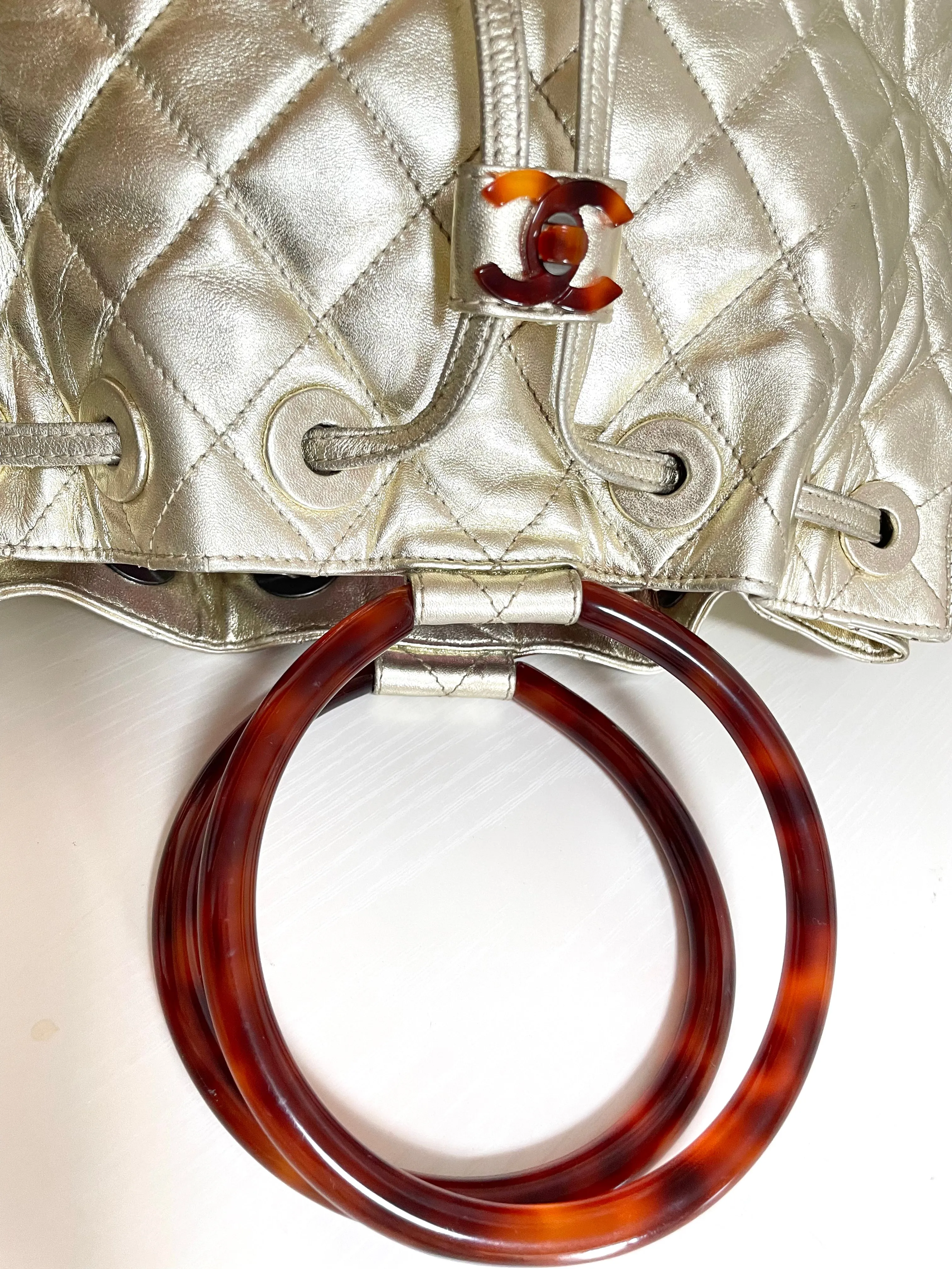 Vintage CHANEL campaign gold lamb leather hobo bucket bag with marble hoop handles and turn lock CC. 0412081
