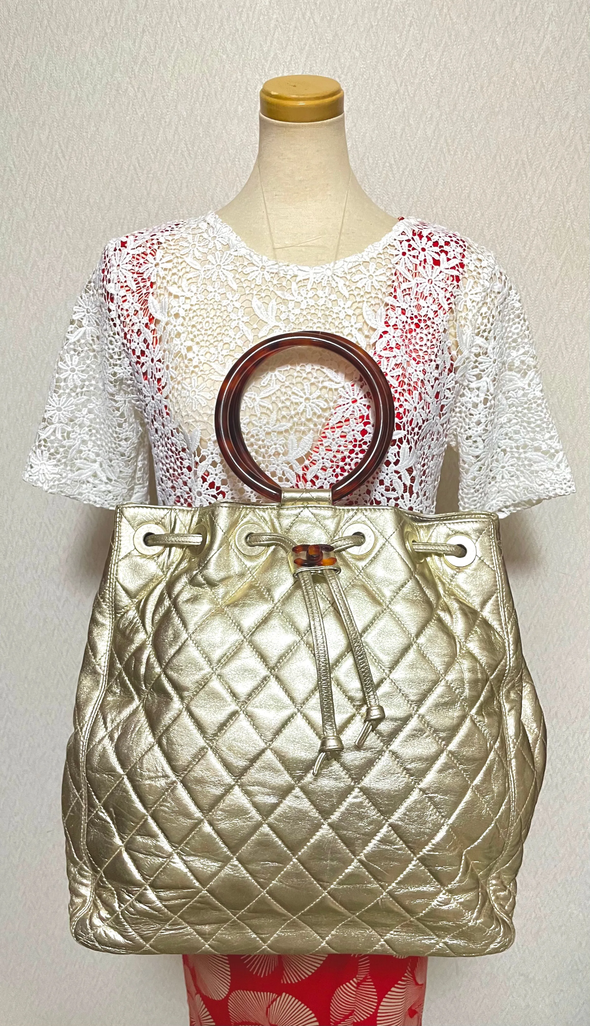 Vintage CHANEL campaign gold lamb leather hobo bucket bag with marble hoop handles and turn lock CC. 0412081