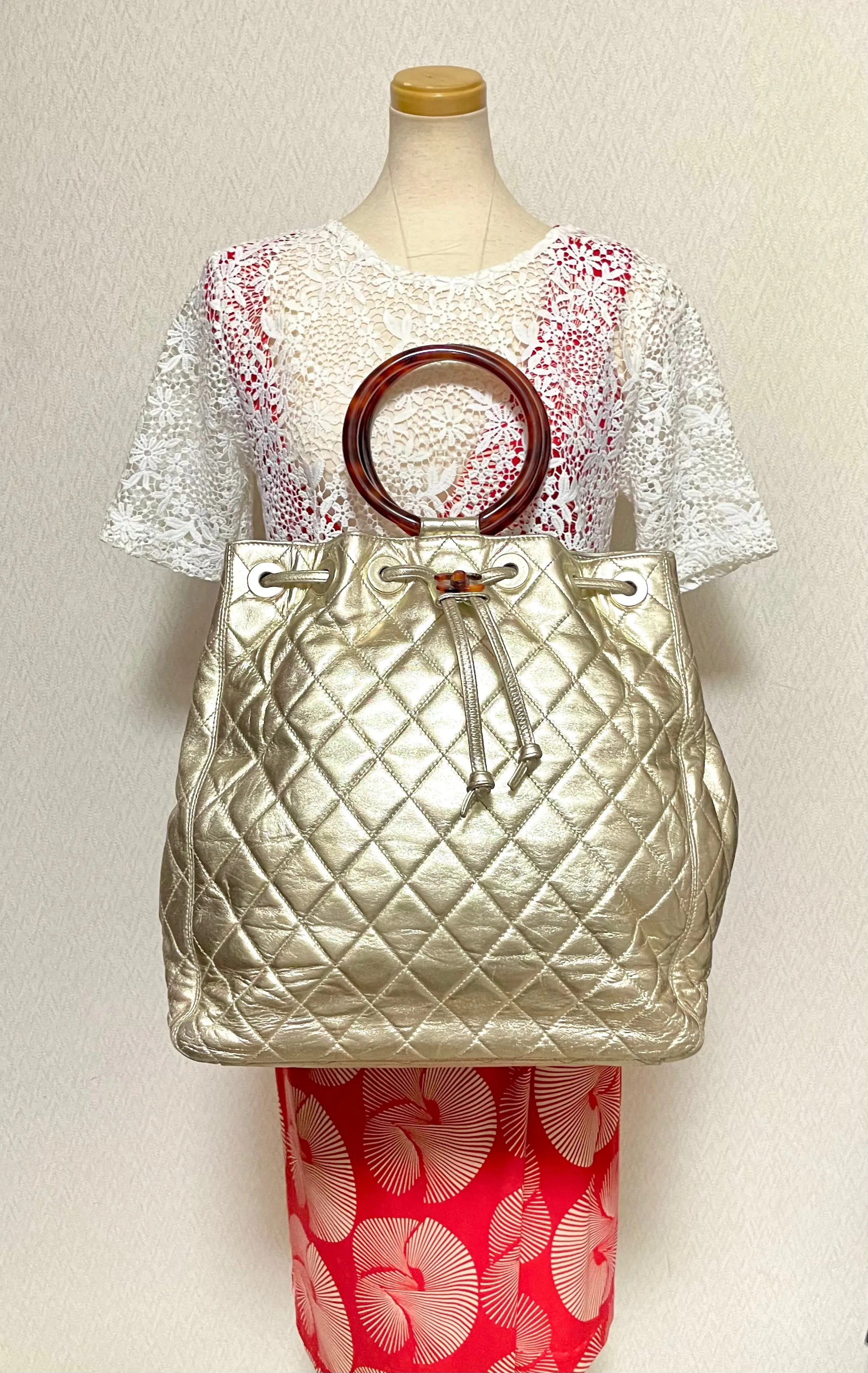 Vintage CHANEL campaign gold lamb leather hobo bucket bag with marble hoop handles and turn lock CC. 0412081