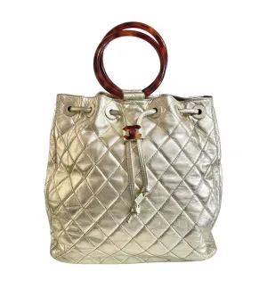 Vintage CHANEL campaign gold lamb leather hobo bucket bag with marble hoop handles and turn lock CC. 0412081