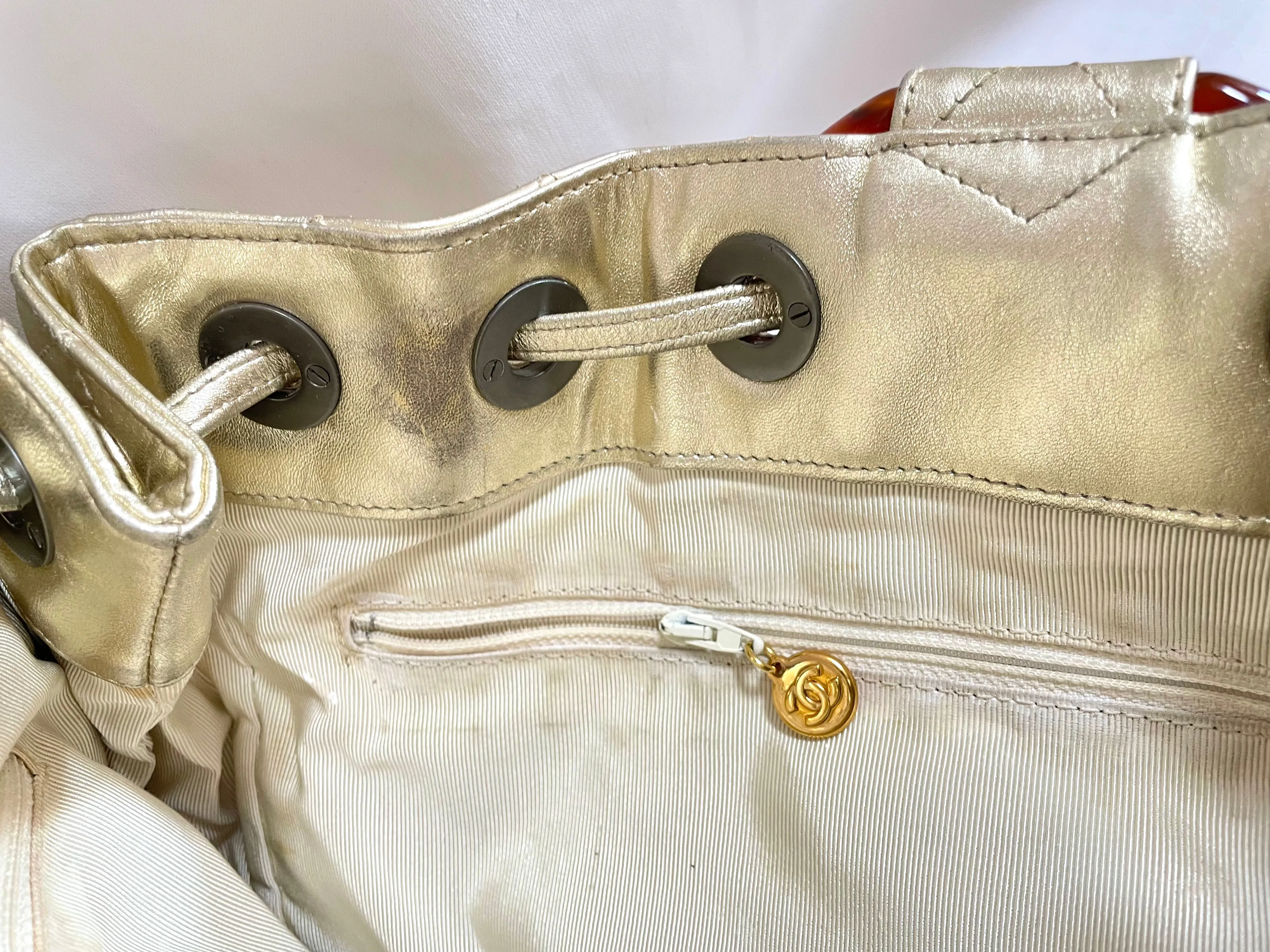 Vintage CHANEL campaign gold lamb leather hobo bucket bag with marble hoop handles and turn lock CC. 0412081