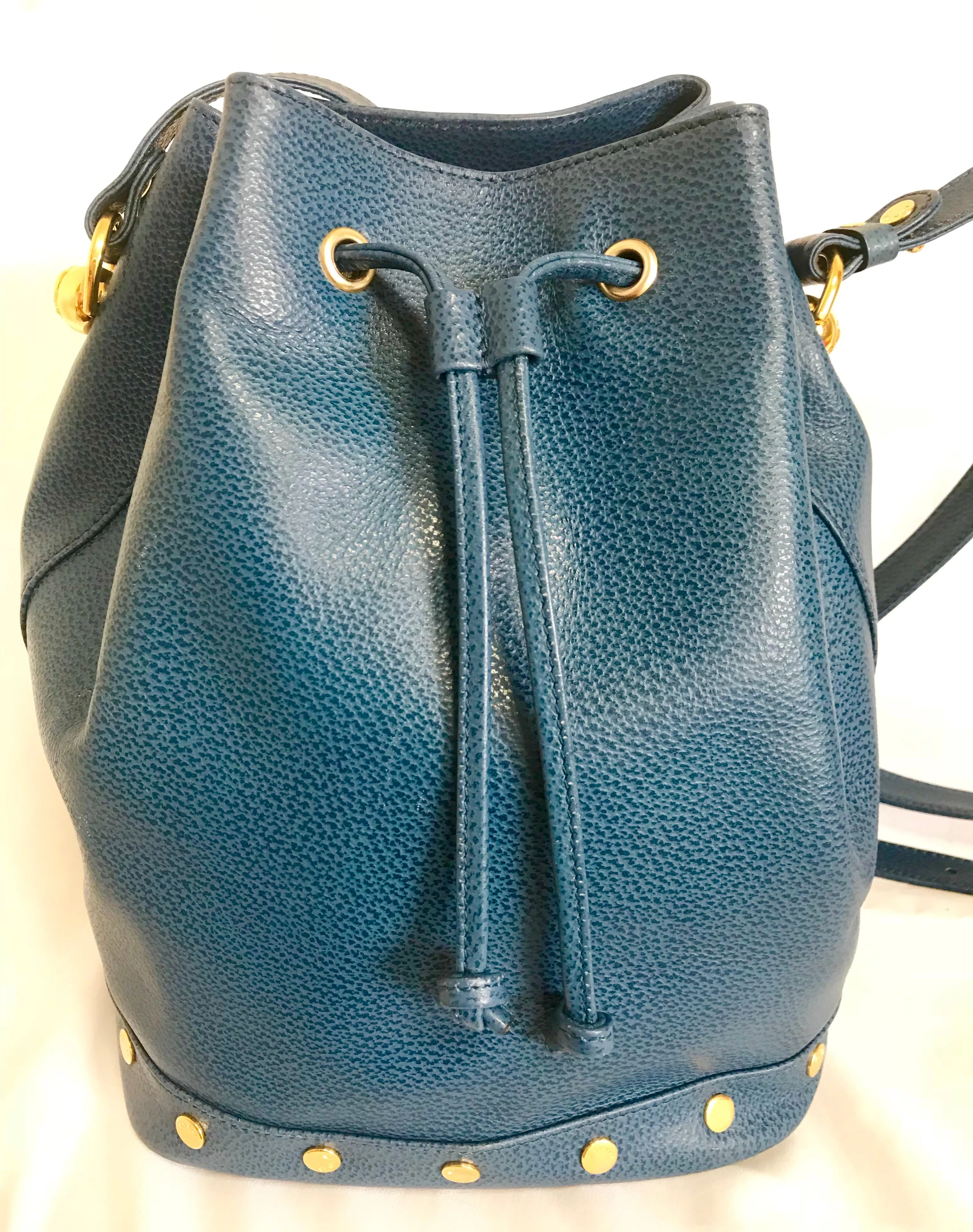Vintage LANVIN blue grained leather hobo bucket shoulder bag with golden logo motifs.