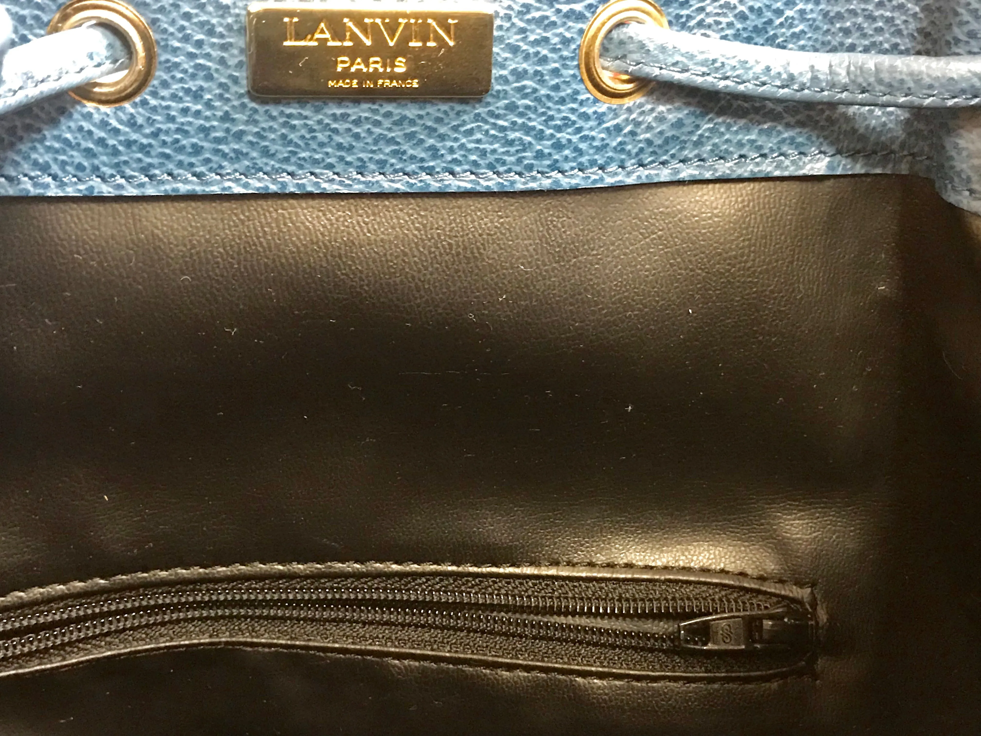 Vintage LANVIN blue grained leather hobo bucket shoulder bag with golden logo motifs.