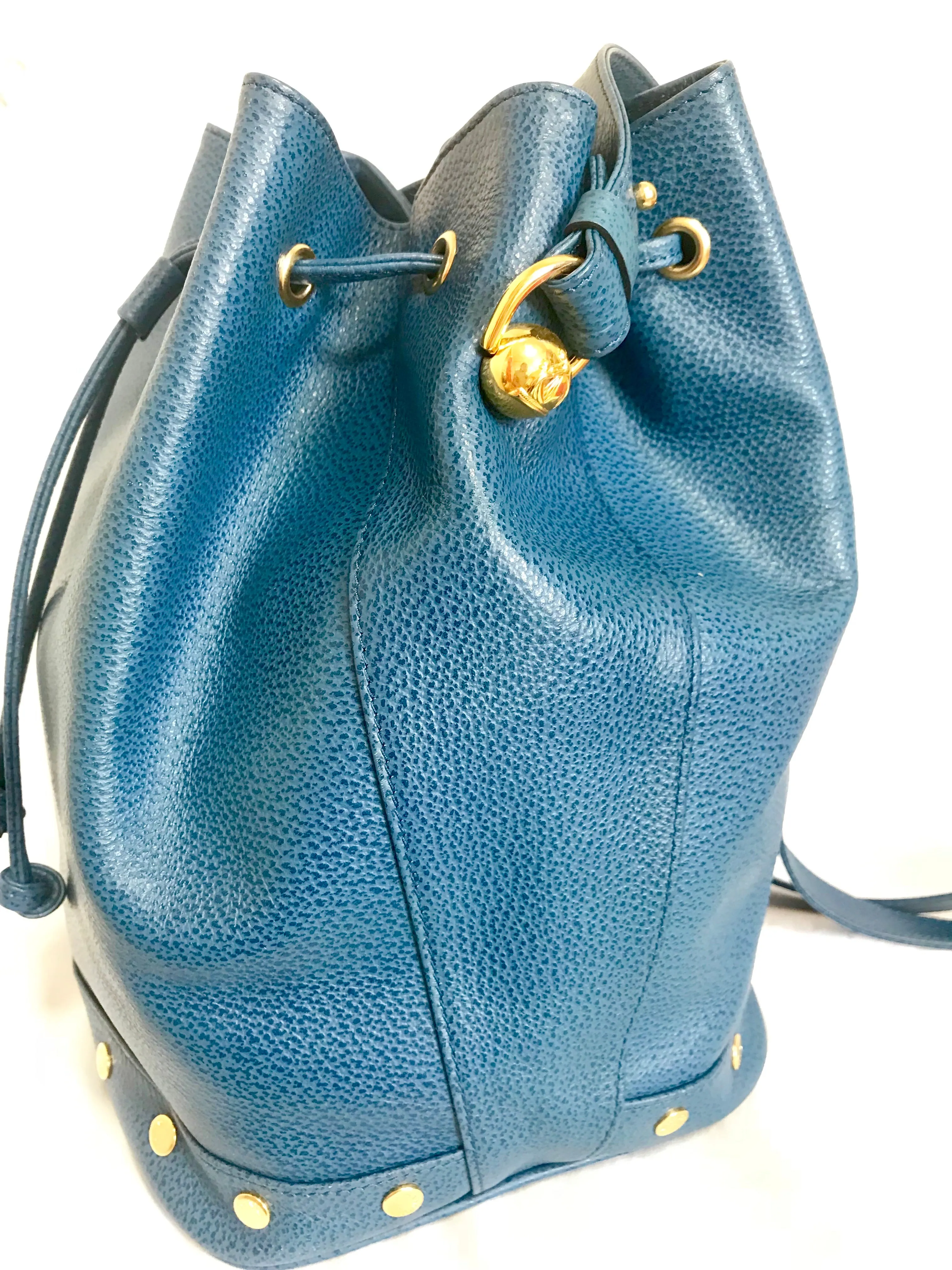 Vintage LANVIN blue grained leather hobo bucket shoulder bag with golden logo motifs.