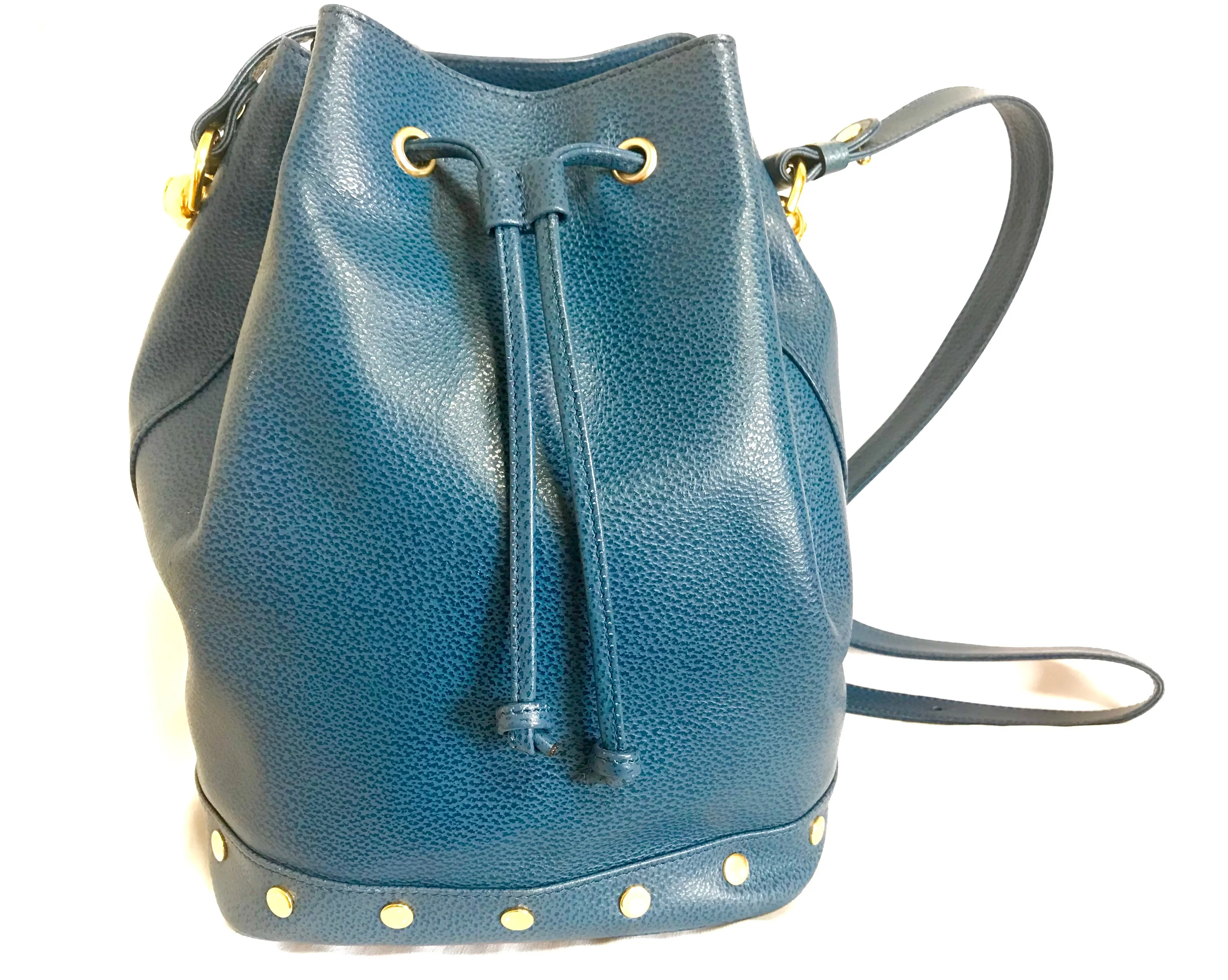 Vintage LANVIN blue grained leather hobo bucket shoulder bag with golden logo motifs.
