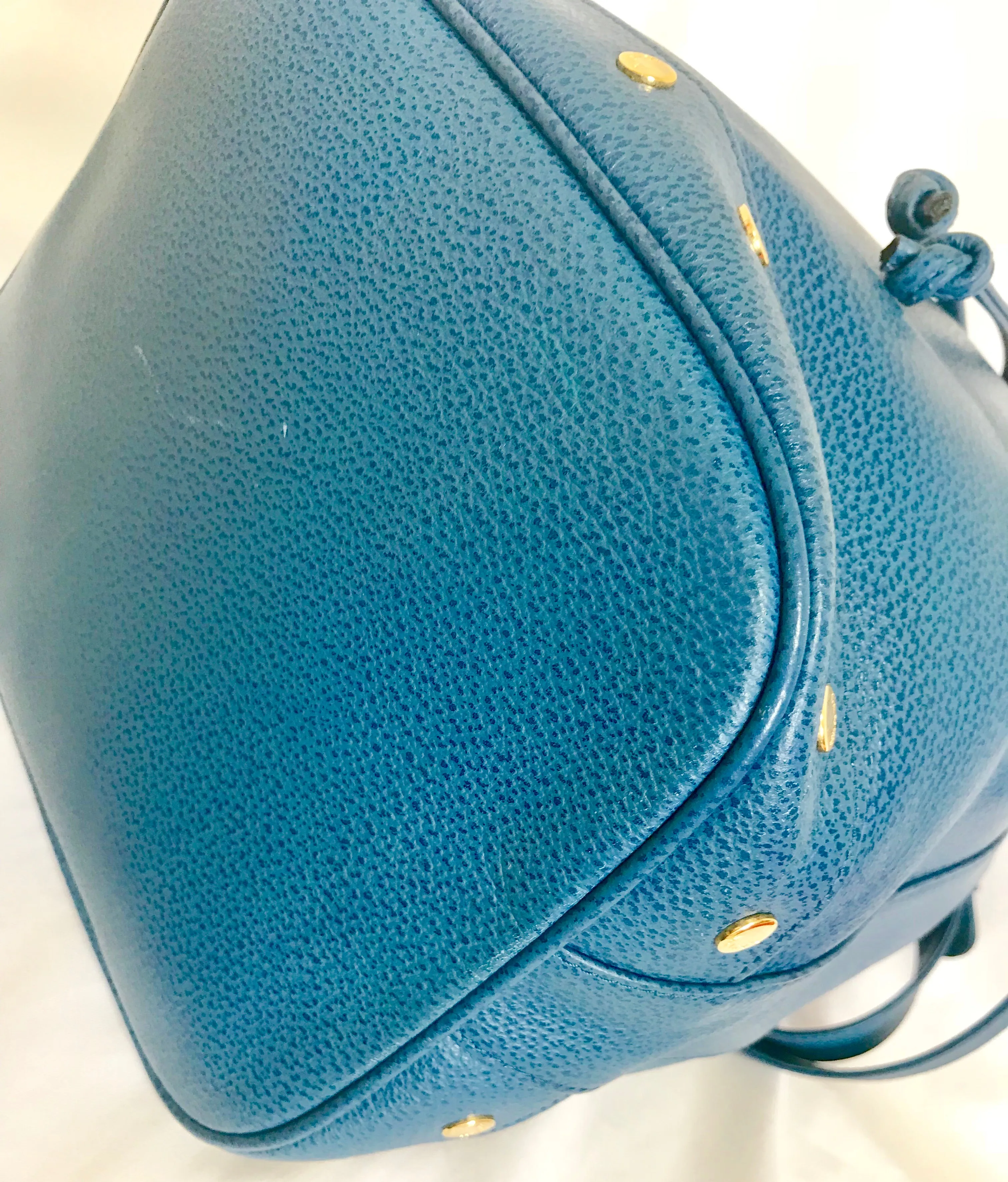 Vintage LANVIN blue grained leather hobo bucket shoulder bag with golden logo motifs.