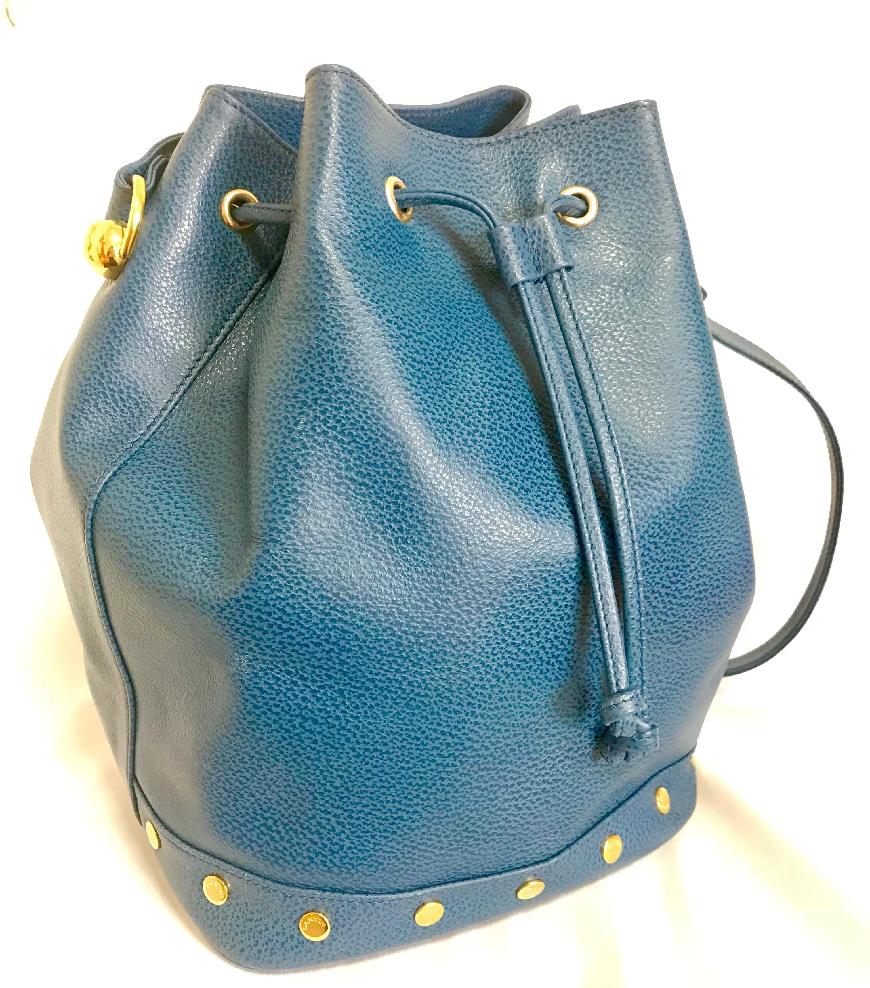 Vintage LANVIN blue grained leather hobo bucket shoulder bag with golden logo motifs.