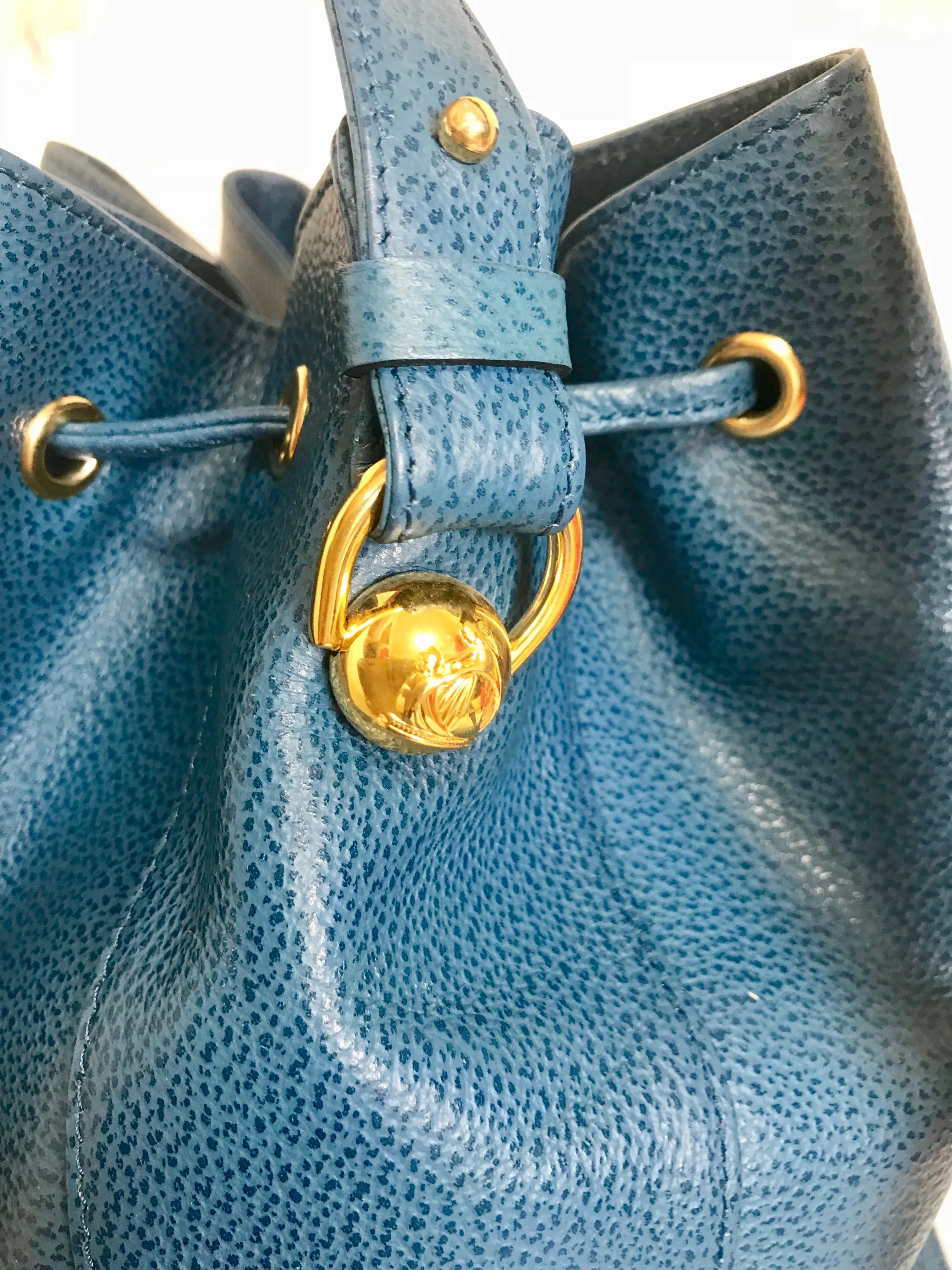 Vintage LANVIN blue grained leather hobo bucket shoulder bag with golden logo motifs.