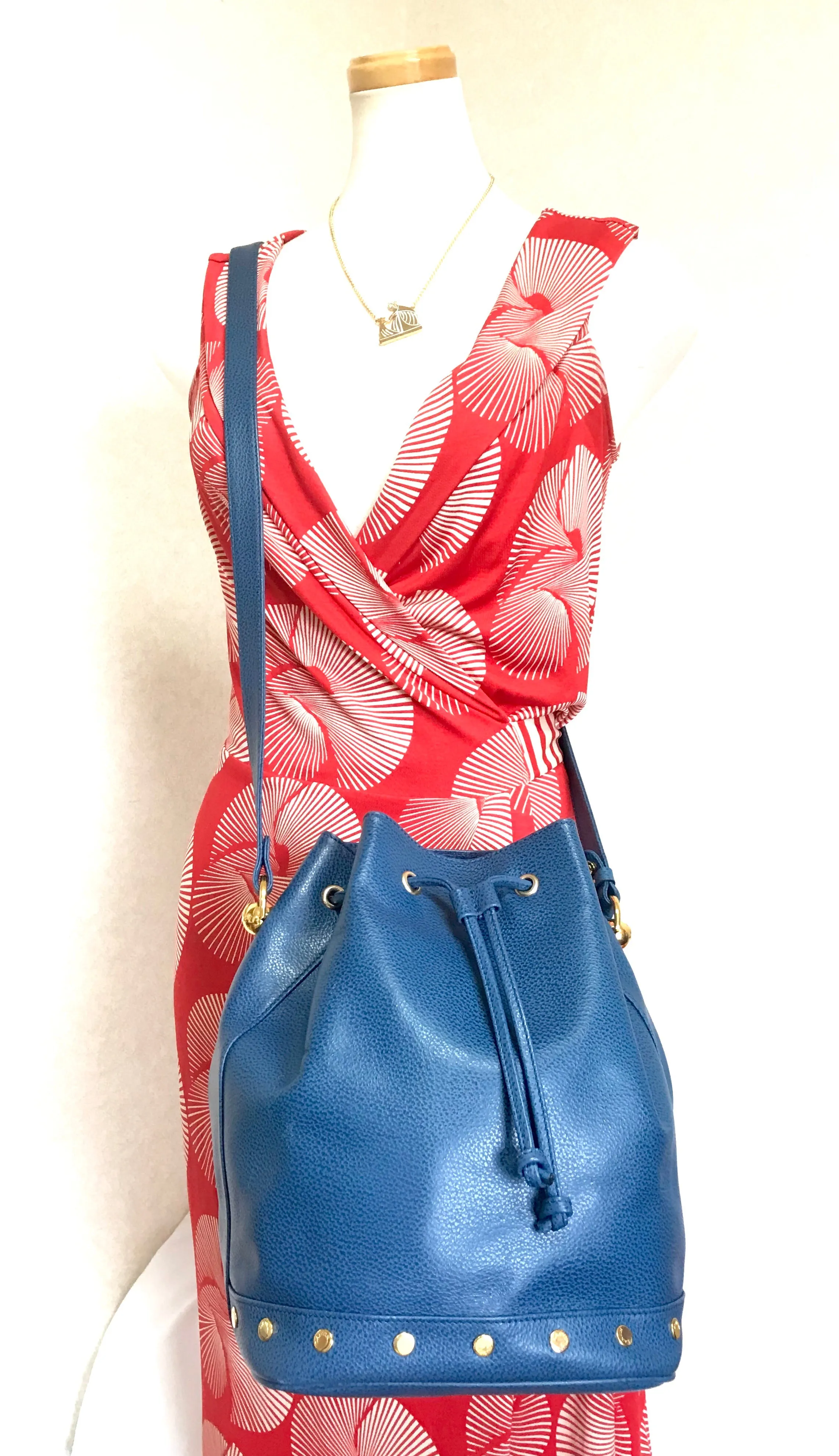 Vintage LANVIN blue grained leather hobo bucket shoulder bag with golden logo motifs.